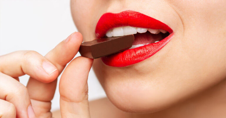 woman eating dark chocolate