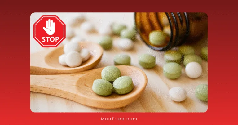 Two wooden spoons hold green and white round tablets, with more tablets scattered nearby from a tipped pill bottle. A red stop sign warns against dangerous male enhancement products.