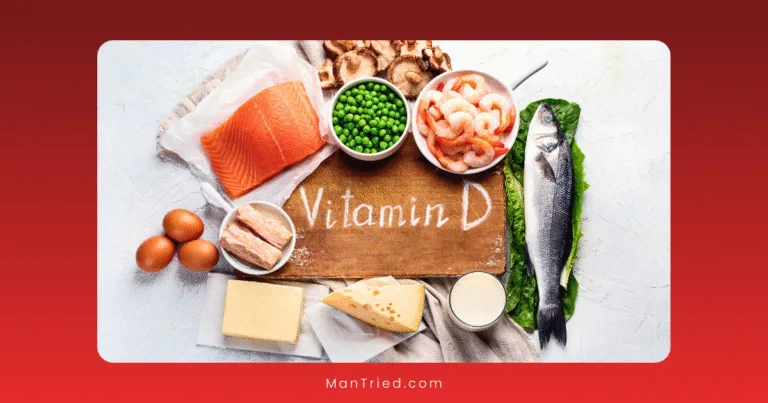 A variety of Vitamin D-rich foods surround a wooden board with Vitamin D written on it, highlighting options that may help prevent vitamin D deficiency and ED. Foods include fish, shrimp, eggs, cheese, butter, peas, mushrooms, canned fish, and milk.