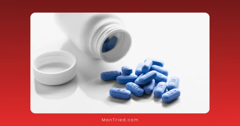 A white pill bottle lies on its side with its cap off, spilling several blue, rectangular tablets onto a white surface—medication commonly used for PrEP and sexual health for gay and bisexual men. The tablets have numbers imprinted on them.
