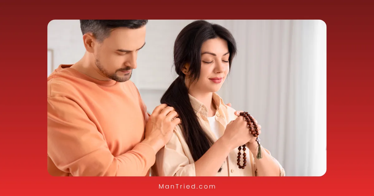 A man gently rests his hand on a woman's shoulder as she holds prayer beads with her eyes closed, both appearing calm and peaceful—reflecting support for faith-compatible treatments.