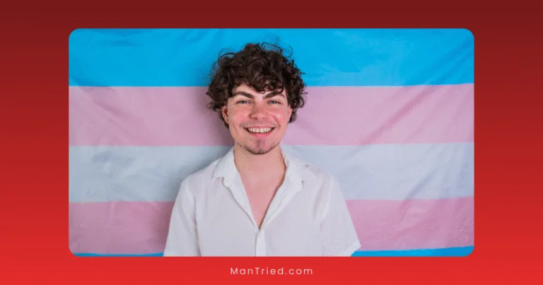 A person with curly hair and a white shirt smiles in front of a transgender pride flag, highlighting transgender men's sexual health. The background is a gradient red.